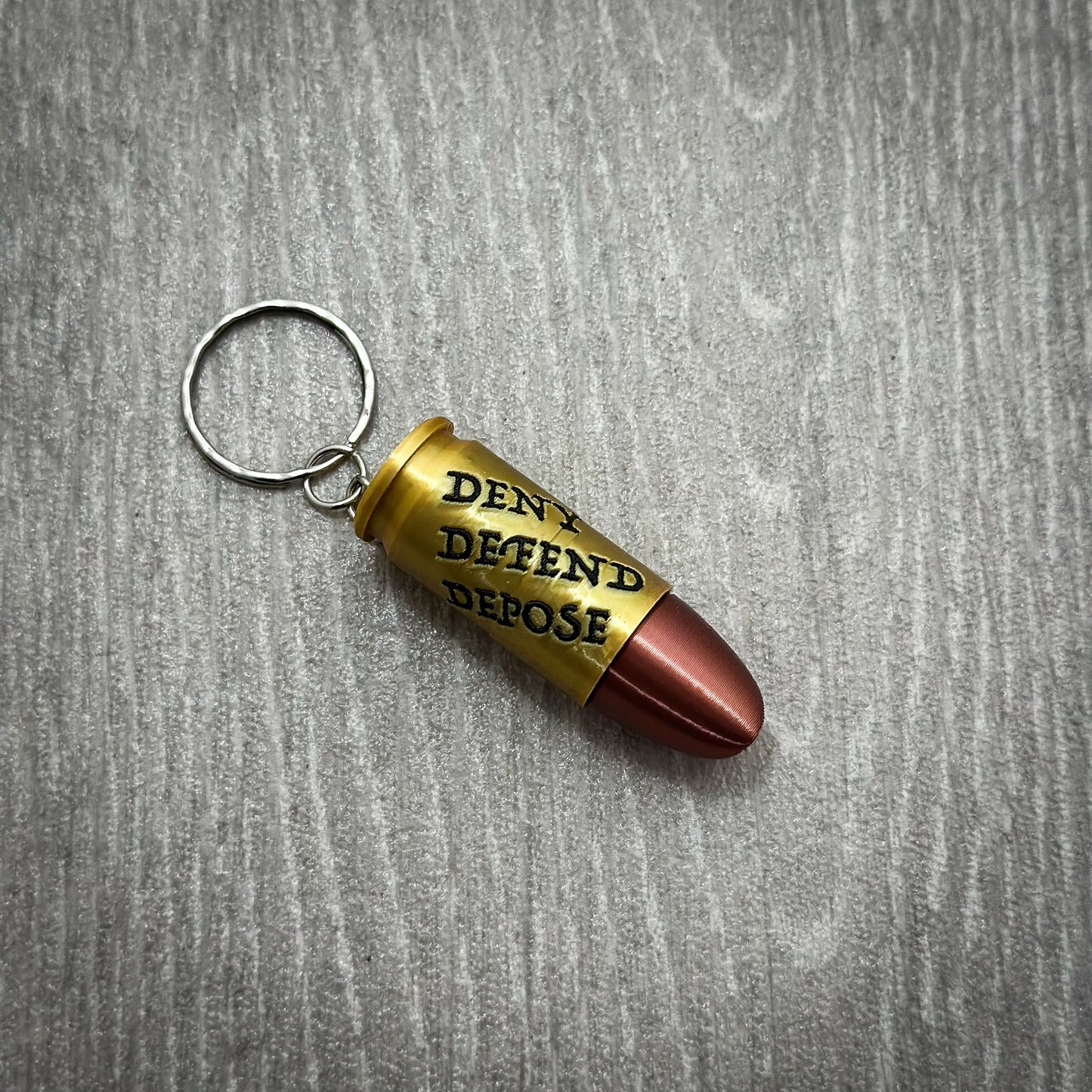 Deny Defend Depose Pill holder keychain