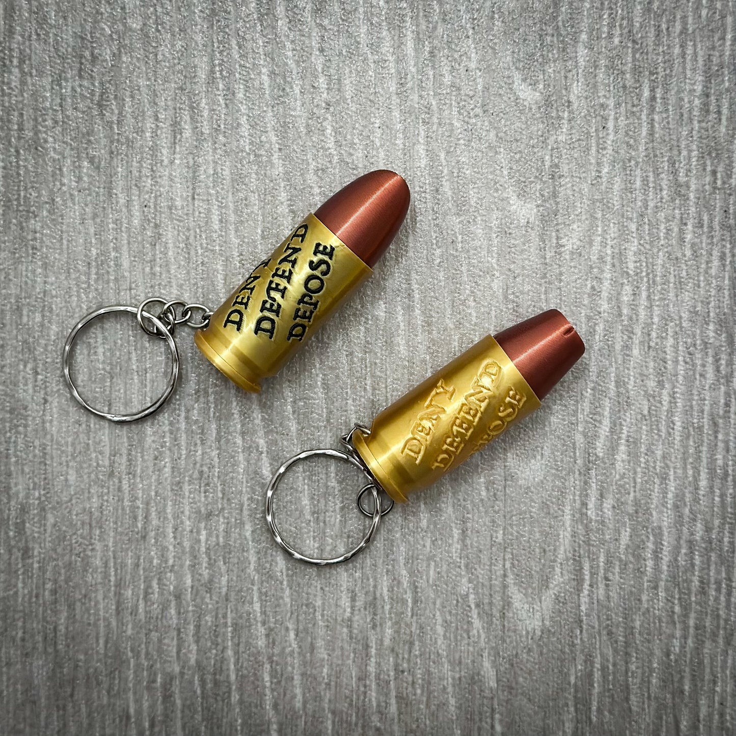 Deny Defend Depose Pill holder keychain