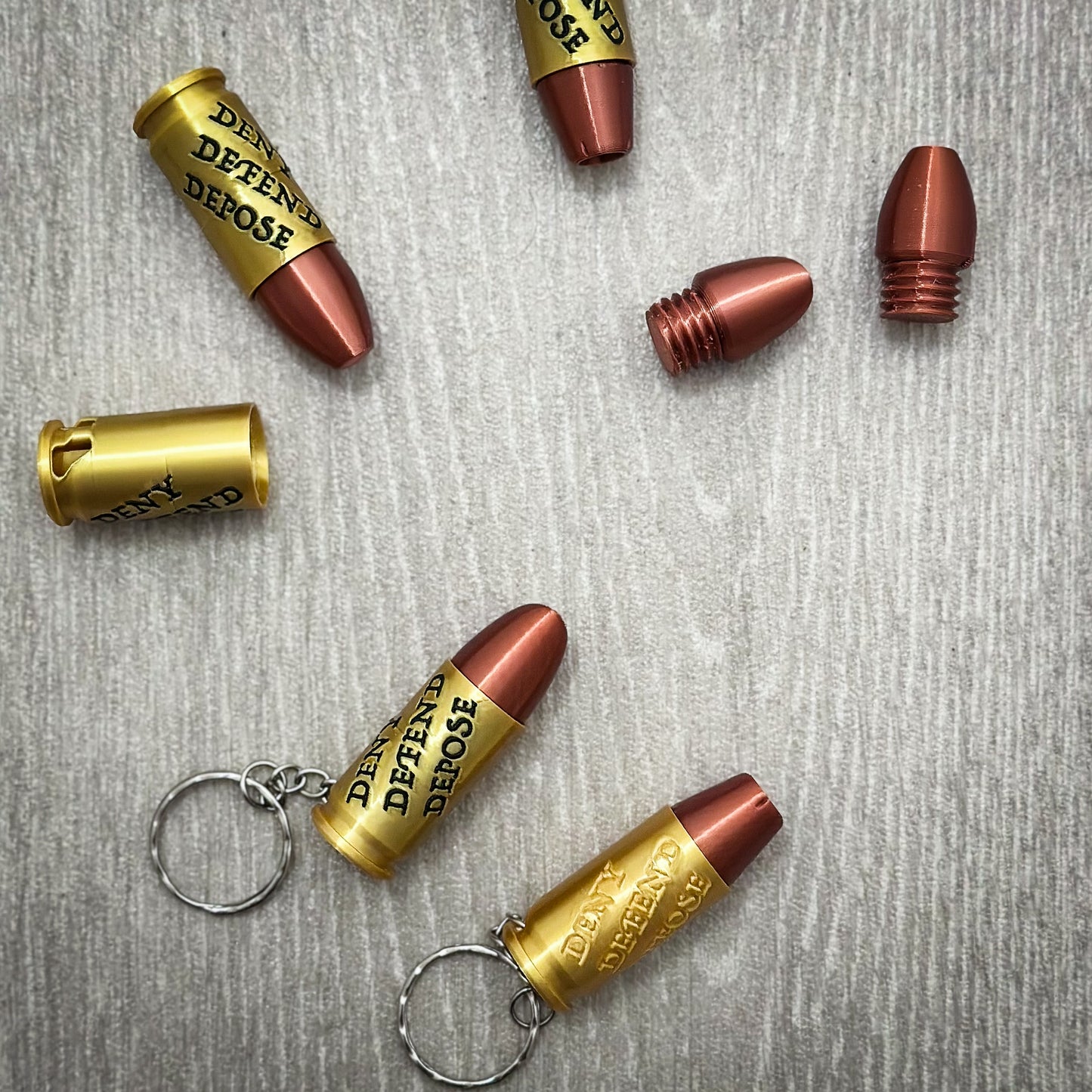 Deny Defend Depose Pill holder keychain