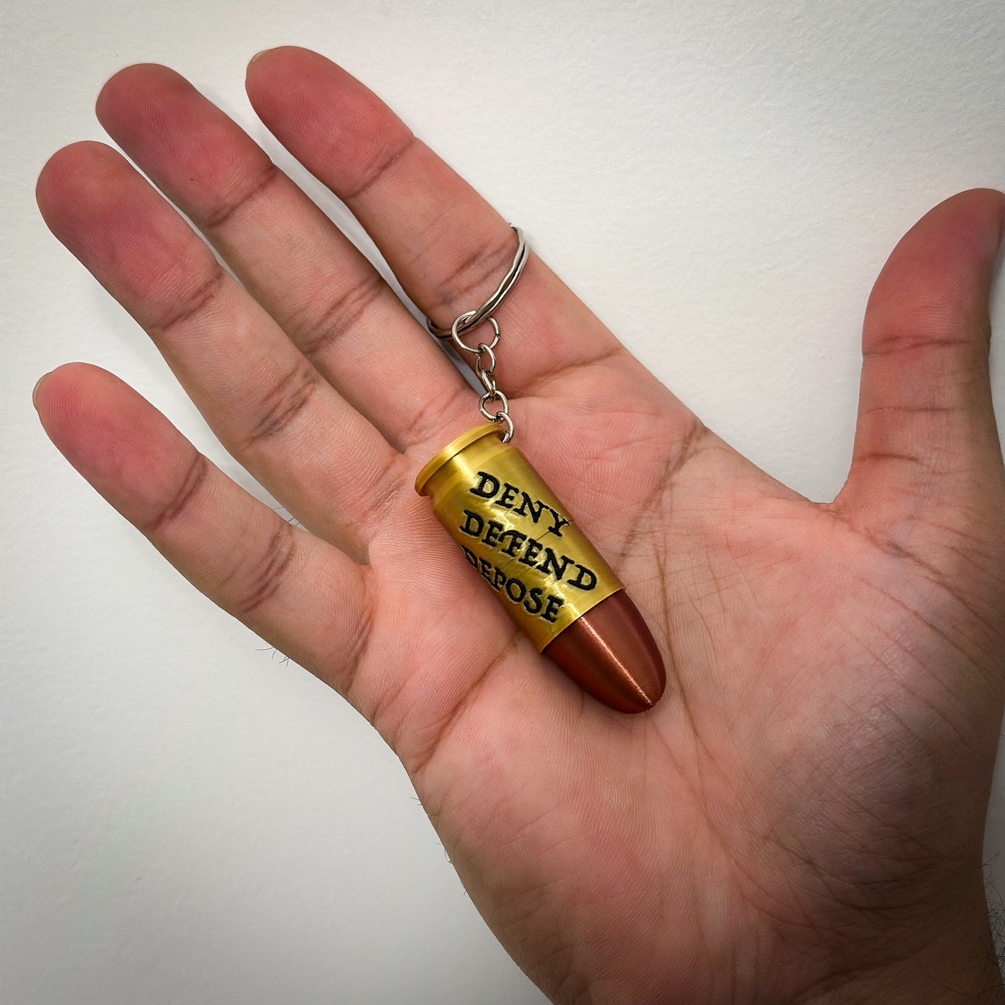 Deny Defend Depose Pill holder keychain