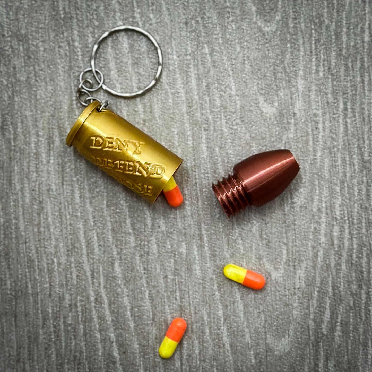 Deny Defend Depose Pill holder keychain